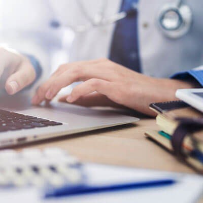 Doctor At Computer