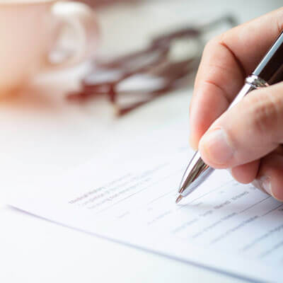 Hand Filling Out Form